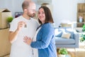 Young couple smiling very happy showing keys of new home, moving and buying new apartmet concept Royalty Free Stock Photo