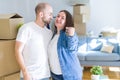 Young couple smiling very happy showing keys of new home, moving and buying new apartmet concept Royalty Free Stock Photo