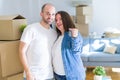Young couple smiling very happy showing keys of new home, moving and buying new apartmet concept Royalty Free Stock Photo