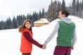 Young Couple Snowy Village Wooden Country House Man And Woman Winter Snow Resort Cottage Royalty Free Stock Photo