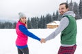 Young Couple Snowy Village Wooden Country House Man And Woman Winter Snow Resort Cottage Royalty Free Stock Photo