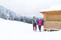 Young Couple Snowy Village Wooden Country House Man And Woman Winter Snow Resort Cottage Royalty Free Stock Photo