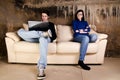 Young couple on sofa Royalty Free Stock Photo