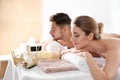 Young couple with spa essentials Royalty Free Stock Photo