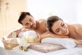 Young couple with spa essentials Royalty Free Stock Photo