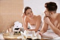 Young couple with spa essentials Royalty Free Stock Photo