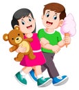 Young couple spend romantic while lady holds teddy bear in hands