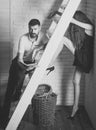 Young couple spend time together on wooden ladder