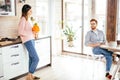 Young couple spending morning in new home, discussing their plans for future Royalty Free Stock Photo