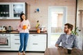 Young couple spending morning in new home, discussing their plans for future. Royalty Free Stock Photo