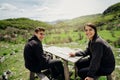 Young couple spending time in nature.Camping road trip.Visiting countryside,active tourism.Hiking in the mountains vacation