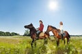 Young couple spending time together riding horses Royalty Free Stock Photo