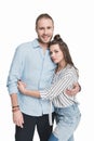 Young couple standing embracing and smiling at camera Royalty Free Stock Photo