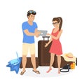 Young couple standing near luggage and using tablet pc to watch photos from their holiday