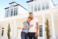 Young Couple Standing Outside Dream Home Royalty Free Stock Photo