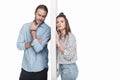 Young couple standing separated by wall isolated on white