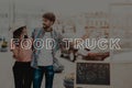 Young Couple Street Walking Near The Food Truck.