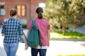 Young couple of students with books and notes outdoors. Smart guy and girl in University campus. Learning and education for young Royalty Free Stock Photo