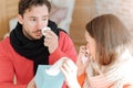 Young couple suffering from flu at home Royalty Free Stock Photo