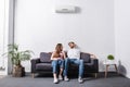 Young couple suffering from heat while