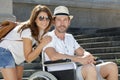 young couple on summer holiday man in wheelchair