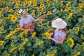 Young couple in sunflower field Royalty Free Stock Photo