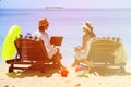 Young couple surfing the net and enjoy beach vacation Royalty Free Stock Photo