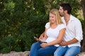Young couple surfing the web outdoor with digital tablet Royalty Free Stock Photo