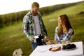 Young couple by the table in the vineyard Royalty Free Stock Photo