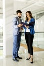 Young couple with tablet in the modern office Royalty Free Stock Photo