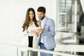 Young couple with tablet in the modern office Royalty Free Stock Photo