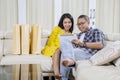 Young couple with tablet and paper bags Royalty Free Stock Photo