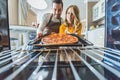 Couple with burnt pizza Royalty Free Stock Photo