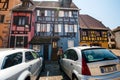 Young couple taking photos in front of the colorful half-timbered houses