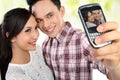 Young couple taking self portrait Royalty Free Stock Photo