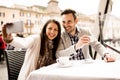 Young couple taking selfie in the restaurant in Rome, Italy Royalty Free Stock Photo