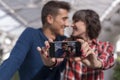 young couple taking a selfie with mobile phone and smiling. Love concept. Indoors