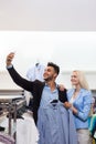 Young Couple Taking Selfie Photo Fashion Shop, Happy Smiling Man And Woman Shopping Customers