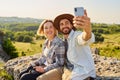 Young couple taking selfie during summer hike Royalty Free Stock Photo