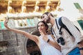 Young couple taking a selfportrait with smartphone. Royalty Free Stock Photo