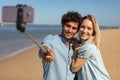 young couple taking vacation selfie photograph at beach Royalty Free Stock Photo