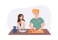 Young couple is talking while cooking breakfast at the dinner table in the kitchen. Woman drinking coffee and talking to Royalty Free Stock Photo