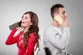 Young couple talking on mobile phones. Royalty Free Stock Photo