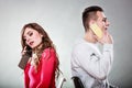 Young couple talking on mobile phones. Royalty Free Stock Photo