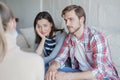 Young couple talking about their problem with psychologist in office. Royalty Free Stock Photo