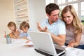 Young couple thinking and looking at a laptop Royalty Free Stock Photo