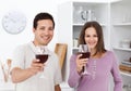 Young couple toasting with glasses of red wine Royalty Free Stock Photo