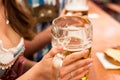 Young couple toasting in Oktoberfest beer tent Royalty Free Stock Photo