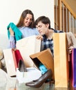 Young couple together with clothes and shopping bags Royalty Free Stock Photo