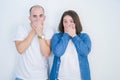 Young couple together over white isolated background shocked covering mouth with hands for mistake Royalty Free Stock Photo